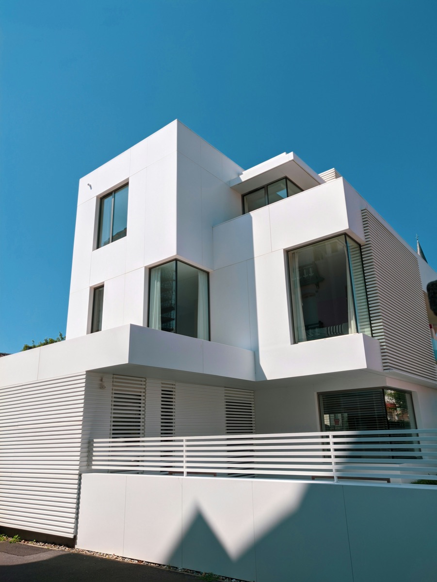 Modern luxury residential building exterior representing Ariston Luxury Homes' residential and commercial portfolio in Delhi